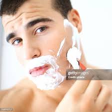 507 Young Adult Man Applying Shaving Cream Stock Photos, High-Res Pictures,  and Images
