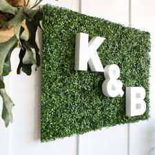 Faux boxwood covers the full height and length of the wall. Diy Foliage Wall With Custom Foam Letters Craftcuts Com