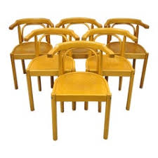 The chair is more comfortable because it has armrests and a rounded back. Cafe Chairs 67 For Sale On 1stdibs