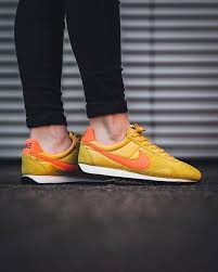 just in nike wmns pre montreal racer vintage gold dart total crimson sail black available now in store and online titolosh sneaker boutique sneakers nike