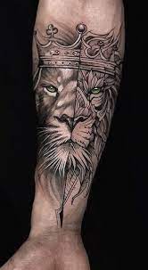 Lion Tattoo Meaning Lion Tattoo Ideas For Men And Women With Photos In 2021 Wrist Tattoos For Guys Lion Tattoo Meaning Lion Tattoo