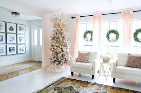 Trendy blush pink holiday decor must haves for christmas. Flocked Christmas Tree With Pink And Gold Accents Classy Clutter