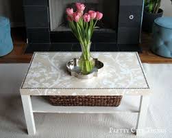 A vintage chest painted white to match shabby chic decor is used as a side table. Elegant Diy Coffee Table Ikea Coffee Table Coffee Table Makeover Ikea Lack Table