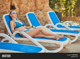 Select from premium swimming pool chair of the highest quality. Young Woman Relaxing Image Photo Free Trial Bigstock