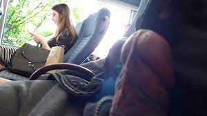 Cumflash next to brunette girl in bus