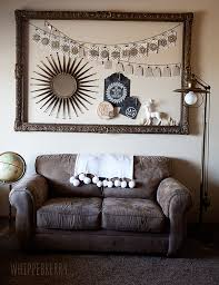 You basically display empty frames on your walls, frames the whole idea behind this type of wall art is to let the frames stand out on their own without any help. From Napkin Rings To Beautiful Wreaths Five Festive Ornament Frame Ideas Whipperberry