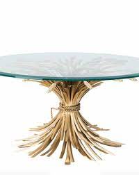 A wonderful example of metal artistry, this table is crafted of solid iron and lacquer finish, and a tempered glass top. Coffee Table Bonheur Coffee Tables Coffee Table In Gold Flowerfeldt