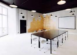 Thin and sleek fixtures in the tech lighting line of linear suspension are the perfect match for modern offices. Monochrome Apartment In Poland Features Conference Spaces