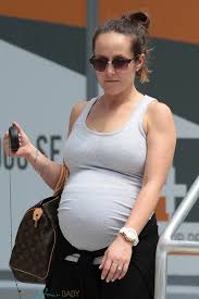 A Very Pregnant Ashley Hebert Arrives In Miami Fl Growing Your Baby