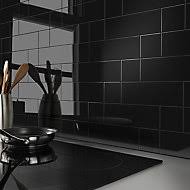 In this new york townhouse 's black and white kitchen, the sleek pendants are from a czechoslovakian factory and the 1940s stools are by warren mcarthur. Black Wall Tiles Tiles B Q