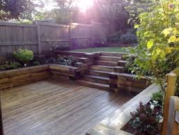 Photo Of Split Level Garden And Decking Railway Sleepers Raised Borders Sloped Garden Backyard Backyard Landscaping