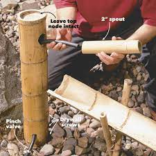 How To Build A Bamboo Water Feature The Family Handyman Bamboo Fountain Diy Water Fountain Bamboo Water Fountain