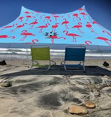 Buy a canopy with guy line attachments. Neso Tents Beach Tent With Sand Anchor Portable Canopy Sunshade 7 X 7 Patented Reinforced Corners Flamingos Buy Online In Belize At Belize Desertcart Com Productid 42077280