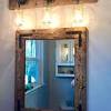 Rustic bathroom vanity mirrors are known to maximize the bathroom's sense of space. 1