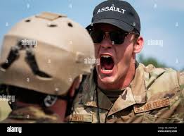 U.S. AIR FORCE ACADEMY, Colo. -- An Academy Cadet Cadre motivates a basic  cadet from the Class of 2025 in the assault course at the U.S. Air Force  Academy's Jacks Valley in