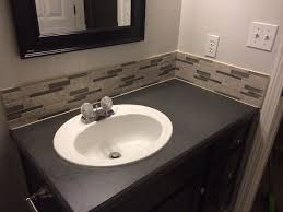 Maybe you would like to learn more about one of these? Diy Textured Spray Paint Countertop And Mosaic Backsplash Using A Special Adhesive Mat Instead Bathroom Countertops Diy Bathroom Countertops Backsplash Designs