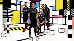A peach coloured puma logo is placed. New Kits For Man City Uniswag