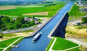The magdeburg water bridge, europe's longest water bridge die grüne zitadelle or the green citadel of magdeburg, a large, pink building of a modern architectural style designed by friedensreich hundertwasser and completed in 2005. Incredible Magdeburg Water Bridge In The Germany Traveleering