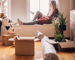 couple with their pet in a new homeの画像