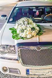 Decorating the wedding car is definitely a fun and creative way to honor (or even embarrass) the newly married couple!. White Bentley Wedding Car Flower Decoration Wedding Car Car Decor Wedding Classic