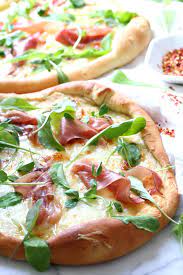 Homemade Prosciutto And Arugula Pizza Recipe Dash Of Savory Recipe Arugula Pizza Arugula Pizza Recipes Recipes