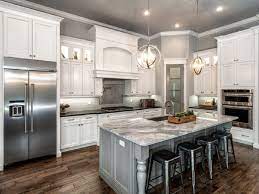 Wondering how to remodel a kitchen? Classic L Shaped Kitchen Remodel With White Cabinet And Gray Island Marble Countertop Kitchen Remodel Small Kitchen Layout White Kitchen Design