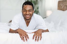 What are some good quotes from good morning africa? Good Morning Positive African American Man Lying On Stomach In Bed Smiling To Camera Posing Waking Up In Bedroom At Home Domestic Lifestyle Recreation Weekend Concept Stock Photo Picture And Royalty Free