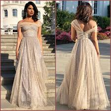 Priyanka Chopra Looks Gorgeous In Dior For Royal Wedding Reception Styled By Mimi Cuttrell Gl Wedding Cocktail Outfits Cocktail Gowns Cocktail Dress Wedding