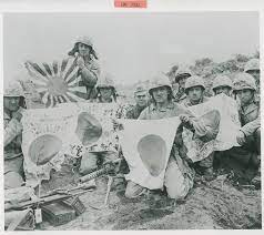 Marines display Japanese battle flags captured on Iwo Jima in February 1945 | The Digital Collections of the National WWII Museum : Oral Histories