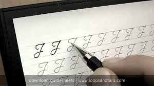 The 'tail' of both the uppercase and lowercase 'j' sit below the line. Learn Cursive Handwriting Capital J Youtube