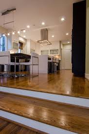Hardwood Step Transition Between Family Room And Kitchen Sunken Living Room Home Design Living Room Apartment Decor Inspiration