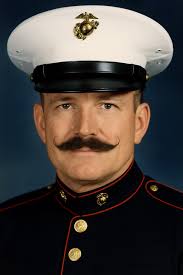 He wore the stripes of a Gunnery Sergeant—and the weight of responsibility  with them. Tom Perry Acton wasn't just a Marine—he was a leader. A teacher.  A warrior committed not only to