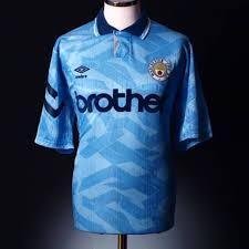 The first commercial manchester city replica shirts released for sale to the public were manufactured by umbro, who enjoyed a long standing relationship with the club. 50 Shades Of Blue A Collection Of Retro Man City Shirts Classic Football Shirts Shirts Manchester City Football Club