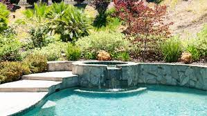 Pool fire bowls can create a warm alluring glow that helps give your backyard a resort atmosphere. 50 Spectacular Swimming Pool Water Features