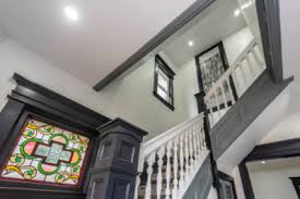 Circular stairs before and after using existing pickets. Indian Home Renovations Brampton Ontario