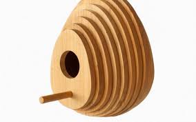Groovy egg birdhouse is sustainable wood for the coziest nest site! 70 Egg Shaped Design Finds