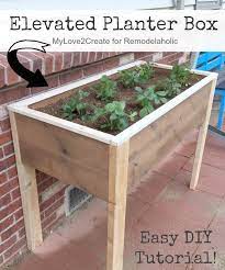 Remodelaholic Build An Elevated Planter Box And Save Your Back Elevated Planter Box Garden Planter Boxes Raised Planter Boxes