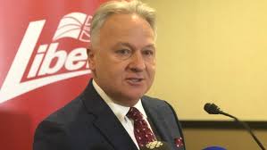 Liberal party president slams door