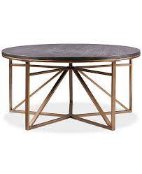 The table top is crafted from layered plywood with a melamine layer completing the top. Macsen Round Geometric Bronze Coffee Table