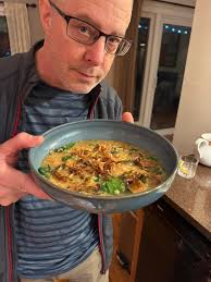 Lentil and bulgur wheat soup (a nice kick of spice) with spinach and topped  with fried shallots 😋 and a side salad looking so festive with pomegranate  seeds! Ken's approval!