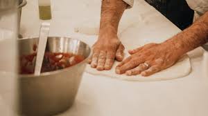 With one smooth motion, push down into the dough, slightly spread your fingers apart, and rotate the dough by rotating your wrist. How To Make An Italian Pizza The Simple Step By Step Guide Walks Of Italy