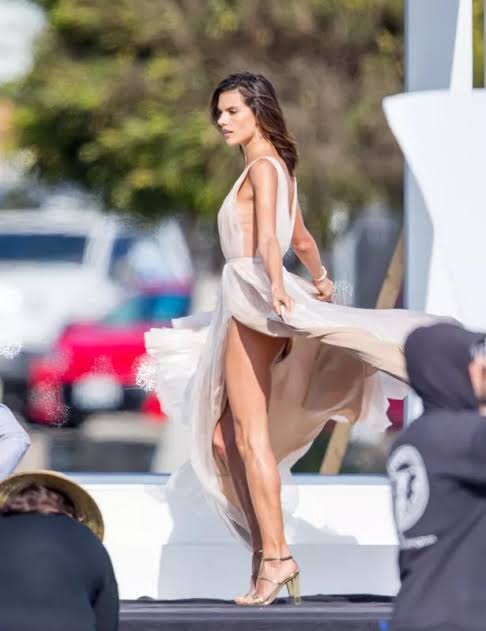 Alessandra Ambrosio suffers nip slip and flashes bum in sheer pink dress at beachside photo shoot - Irish Mirror