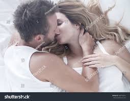 We start loving everything when we fall in love & love changes our life completely & make it like heaven. Romantic Couple In Love Kissing In Bed Royalty Free Stock Photo 409470220 Avopix Com