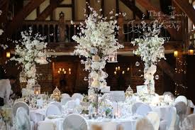 Reuse ceremony flowers for the cake table. Fine Flowers Company Surrey Wedding Flowers Bridal Flowers Surrey