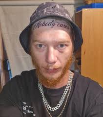 Reactions to a 'nobody cares' head tattoo