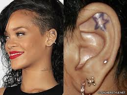 A small moon tattoo looks excellent behind your ear as it will be more visible. Rihanna S Tattoos Meanings Steal Her Style