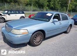Image result for Light Ice Blue 2005 Town Car