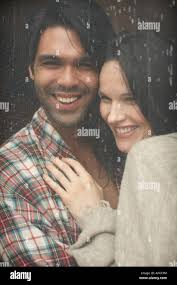 Couple rain running hi-res stock photography and images