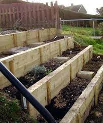 How To Build A Terraced Garden On A Slope Raised Garden Bed On Sloped Area Gardening Raising Gardens An Sloped Backyard Landscaping Sloped Garden Garden Stairs