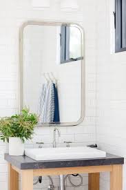 blond sink vanity with shallow vessel
